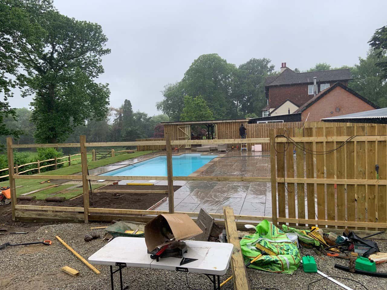 This is a photo of Bespoke custom fencing installed around a swimming pool by Fast Fix Fencing Newmarket