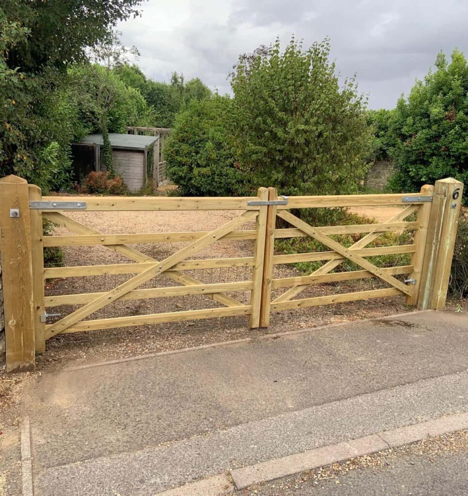 This is a photo of a wooden driveway gate installed by Fast Fix Fencing Newmarket